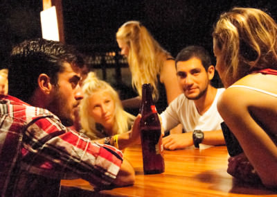Group of people playing games at a table at night